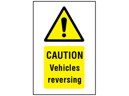 Caution Vehicles reversing symbol and text safety sign.