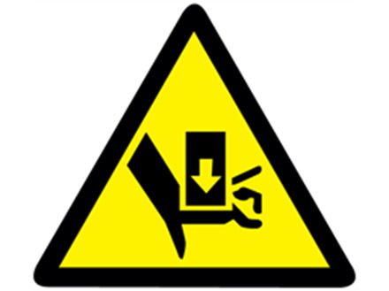 Crush hazard warning symbol label.