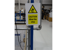 Caution, Mind the step symbol and text safety sign.