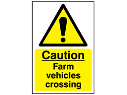Caution, farm vehicles crossing safety sign.