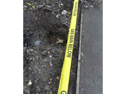 Caution gas main below tape.