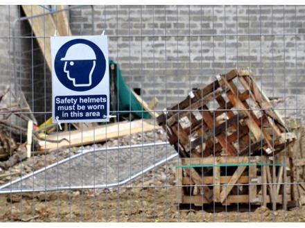 Safety helmets must be worn on site symbol and text safety sign.